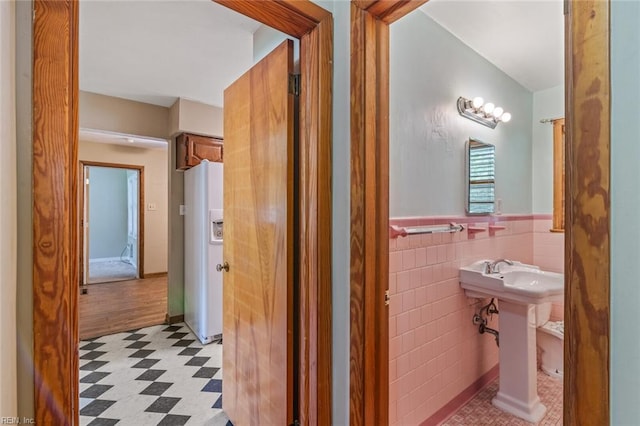 100 Hudgins Rd, Poquoson, VA 23662 - half bath featuring tile patterned floors, wainscoting, and tile walls