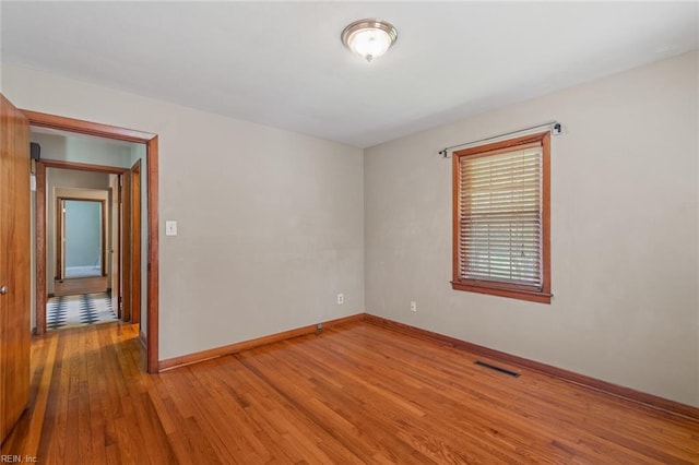 100 Hudgins Rd, Poquoson, VA 23662 - unfurnished room with baseboards and wood finished floors