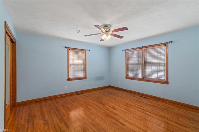 100 Hudgins Rd, Poquoson, VA 23662 - spare room featuring baseboards, a ceiling fan, light wood-style flooring, and visible vents