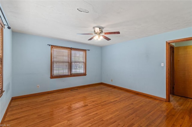 100 Hudgins Rd, Poquoson, VA 23662 - unfurnished room featuring light wood-style floors, baseboards, and a ceiling fan