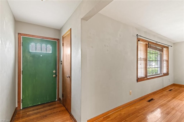 100 Hudgins Rd, Poquoson, VA 23662 - entryway featuring wood-type flooring, baseboards, and visible vents