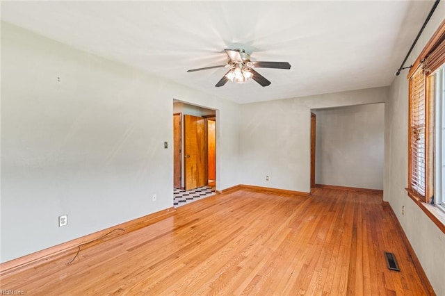 100 Hudgins Rd, Poquoson, VA 23662 - spare room with visible vents, a ceiling fan, a healthy amount of sunlight, and hardwood / wood-style floors