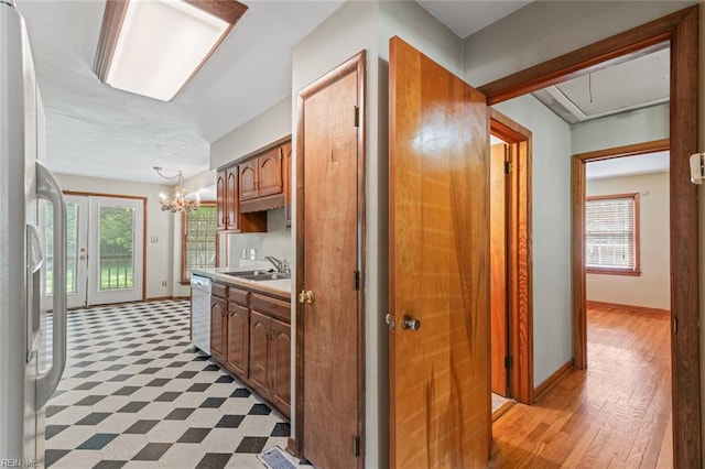 100 Hudgins Rd, Poquoson, VA 23662 - kitchen featuring a sink, light countertops, a wealth of natural light, and dishwasher