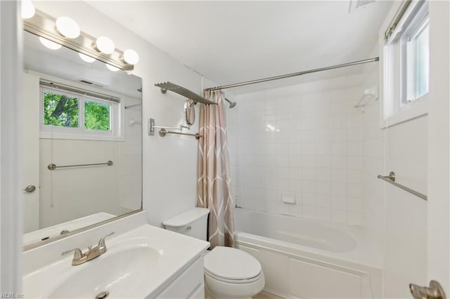 full bathroom with toilet, visible vents, shower / bath combo, and vanity