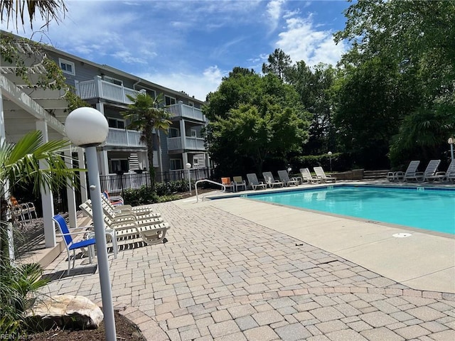 500 Ocean Trace Arch Unit 301, Virginia Beach, VA 23451 - community pool featuring a patio