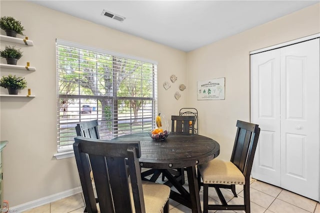 dining room featuring visible vents, baseboards, and light tile patterned flooring