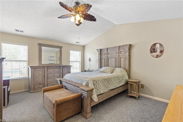 bedroom with visible vents, baseboards, light colored carpet, a textured ceiling, and vaulted ceiling