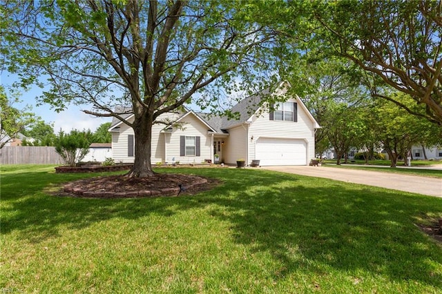 view of front of house with fence, an attached garage, driveway, and a front lawn