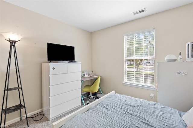 bedroom featuring carpet floors, baseboards, and visible vents