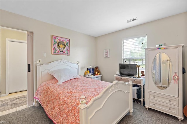 carpeted bedroom with visible vents