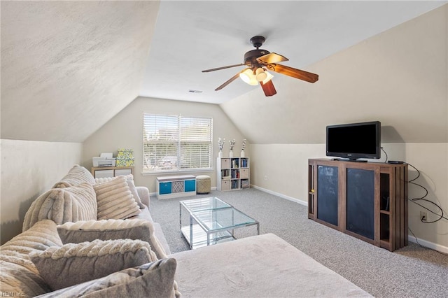 living room with carpet flooring, a ceiling fan, baseboards, and lofted ceiling