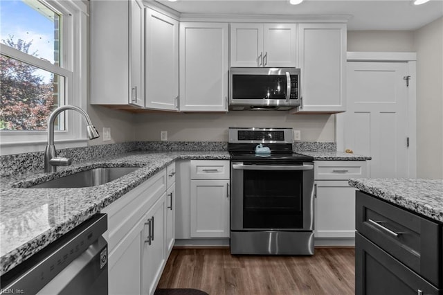 2600 Smithson Dr, Chesapeake, VA 23322 - kitchen featuring white cabinets, a sink, stainless steel appliances, recessed lighting, and dark wood-style floors