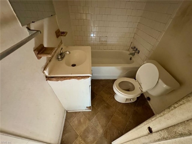 bathroom featuring vanity, tile patterned flooring, and toilet