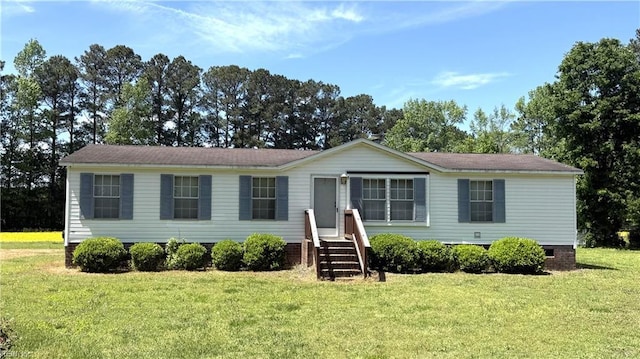 manufactured / mobile home with a front lawn