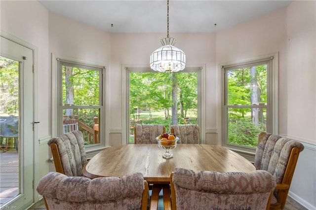 sunroom with a chandelier