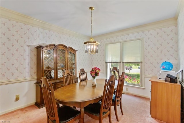dining room featuring crown molding, light colored carpet, wallpapered walls, and a chandelier