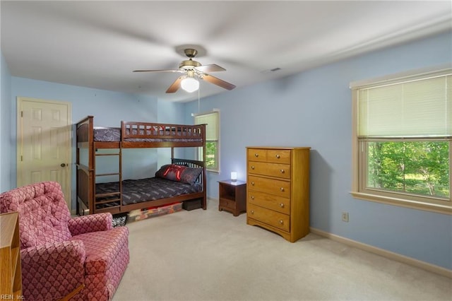 bedroom featuring carpet floors, baseboards, ceiling fan, and visible vents