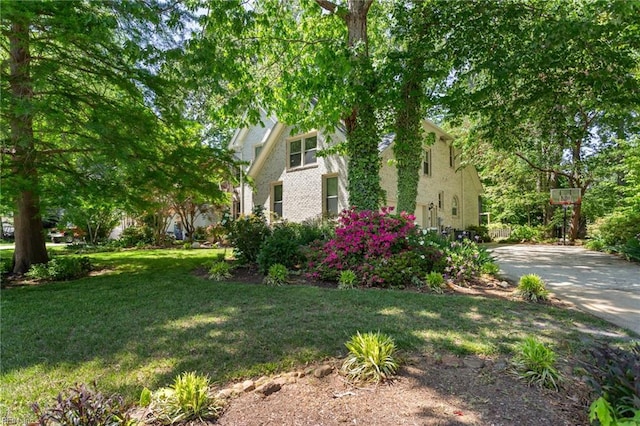 view of property exterior with a yard