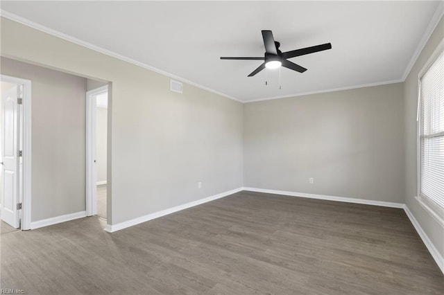 unfurnished room with a ceiling fan, baseboards, and wood finished floors