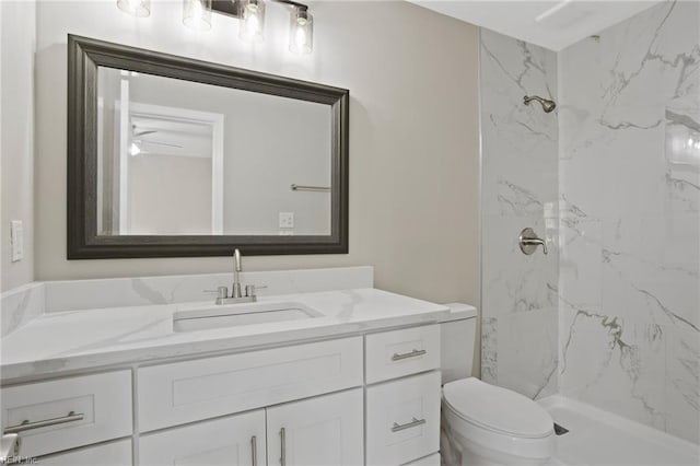 full bathroom with toilet, a marble finish shower, and vanity