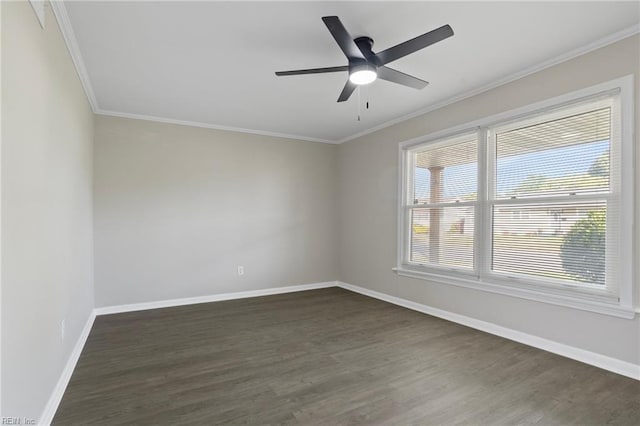 spare room featuring crown molding, dark wood-style flooring, baseboards, and ceiling fan