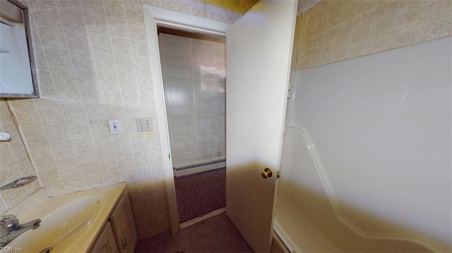 1233 Transylvania Ave, Chesapeake, VA 23324 - bathroom with a baseboard radiator, vanity, and tile walls
