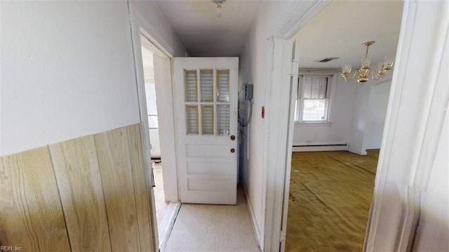 1233 Transylvania Ave, Chesapeake, VA 23324 - doorway to outside featuring a chandelier, baseboard heating, and carpet