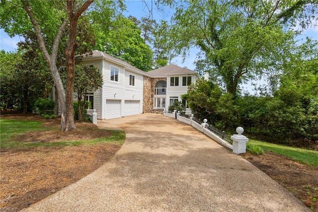 view of front of home with a garage and concrete driveway