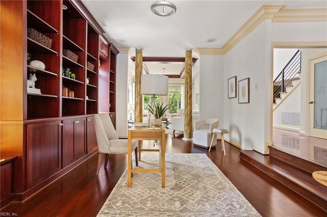 sitting room featuring stairs, dark wood-style flooring, baseboards, and ornamental molding