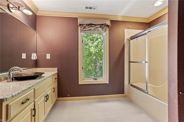 bathroom with visible vents, tile patterned floors, baseboards, vanity, and ornamental molding