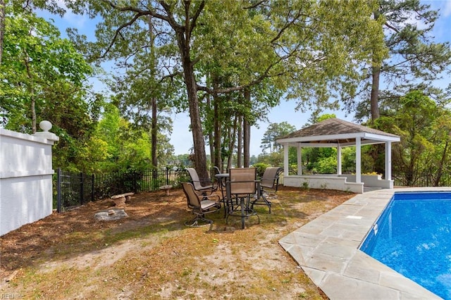 view of pool with a gazebo, a patio area, fence, and a fenced in pool