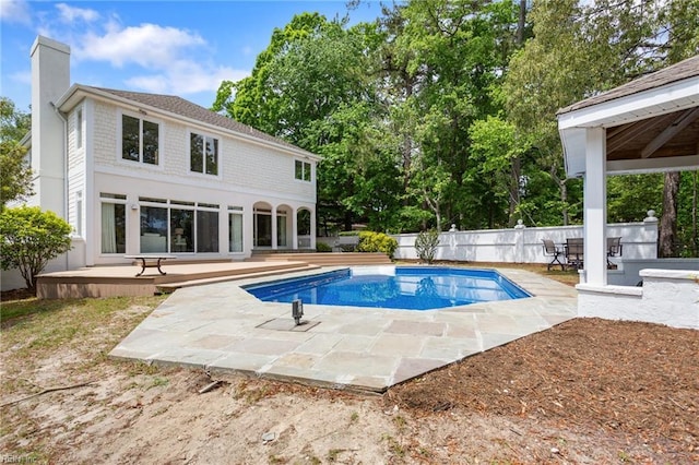view of swimming pool with a fenced in pool, a patio, fence private yard, and a wooden deck