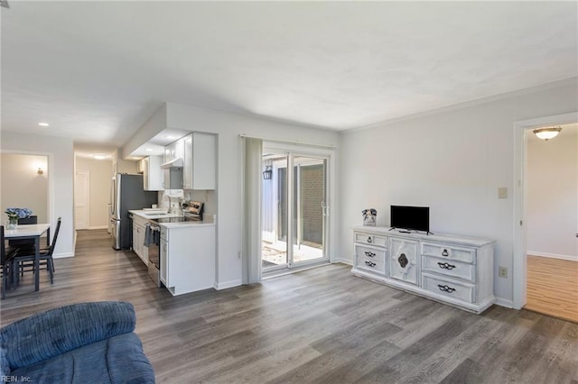 living room with recessed lighting, baseboards, and dark wood finished floors