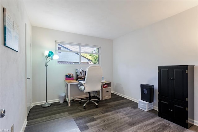 office space with baseboards and wood finished floors