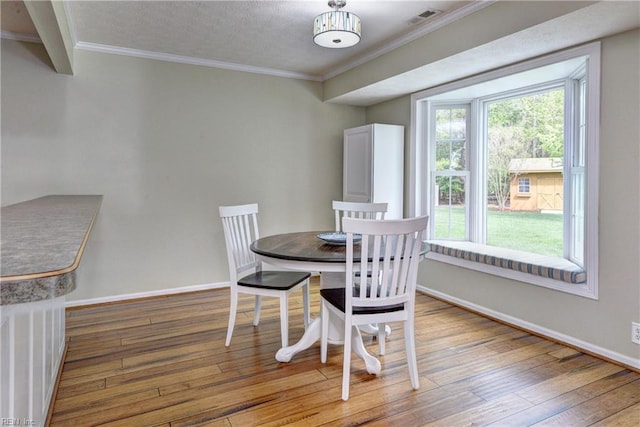 109 Van Curen Ct, Yorktown, VA 23693 - dining area featuring crown molding, baseboards, wood-type flooring, and visible vents