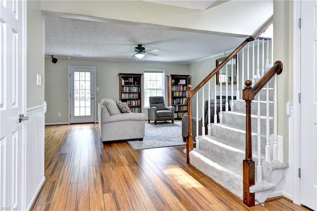 109 Van Curen Ct, Yorktown, VA 23693 - living area featuring a ceiling fan, a wealth of natural light, stairway, and hardwood / wood-style floors