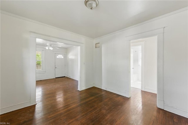 foyer with crown molding, a ceiling fan, baseboards, and hardwood / wood-style floors