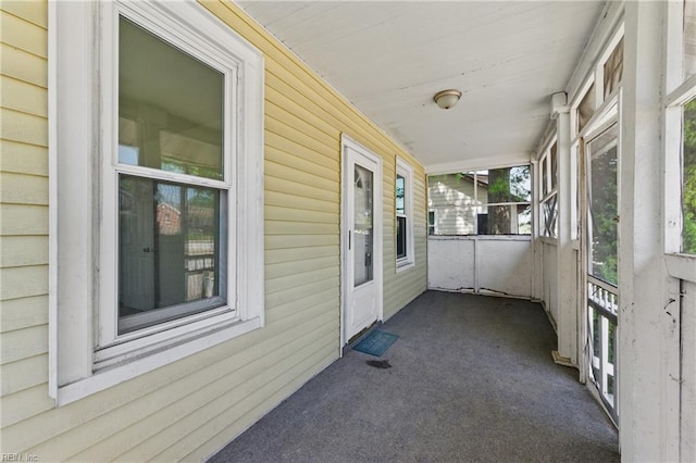 view of property exterior with a porch