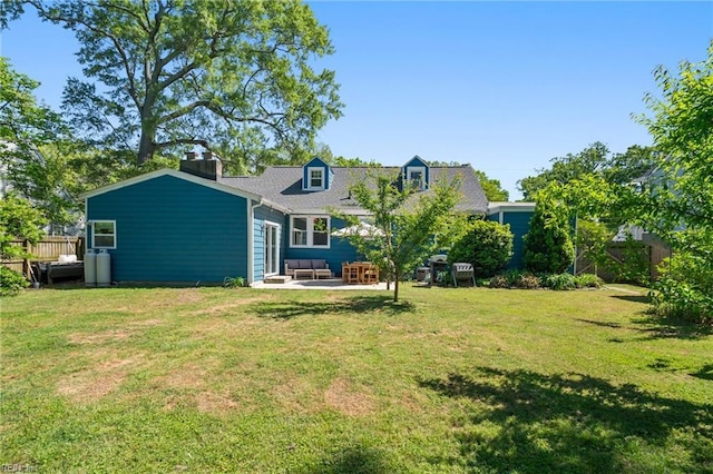 back of property featuring a patio area, fence, and a lawn