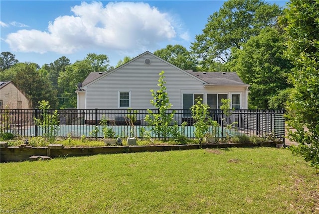 189 George Washington Hwy S, Chesapeake, VA 23323 - rear view of house featuring a lawn and fence