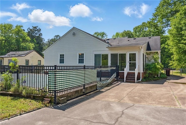 189 George Washington Hwy S, Chesapeake, VA 23323 - back of property featuring a shingled roof and fence