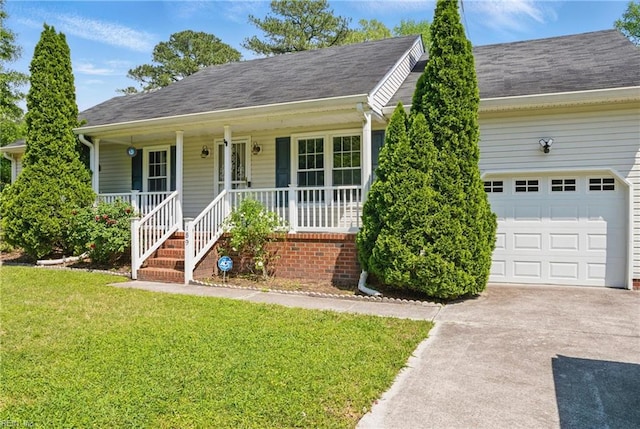 189 George Washington Hwy S, Chesapeake, VA 23323 - view of front of property with a front yard, roof with shingles, concrete driveway, an attached garage, and a porch