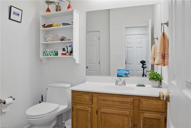 half bath featuring toilet and vanity