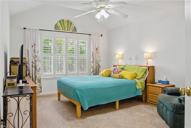 bedroom with carpet, ceiling fan, and vaulted ceiling