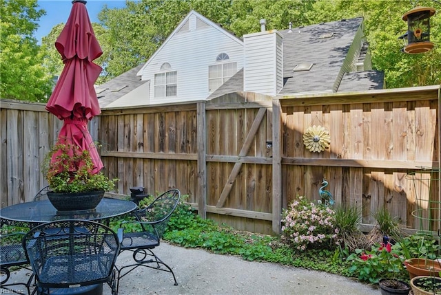 view of patio / terrace featuring outdoor dining area and fence