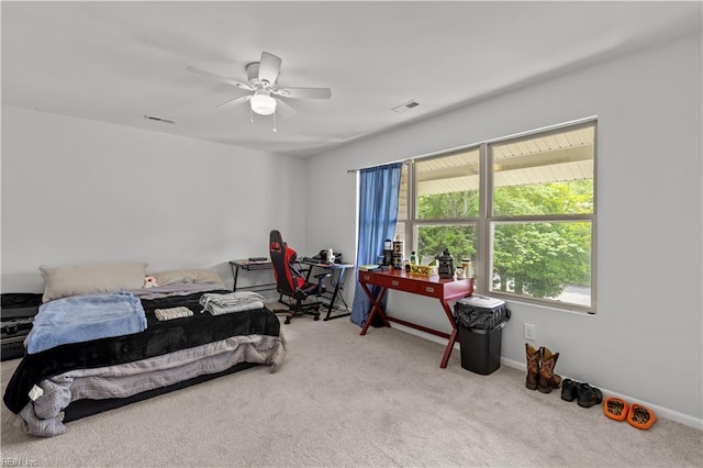 bedroom with carpet flooring, a ceiling fan, baseboards, and visible vents