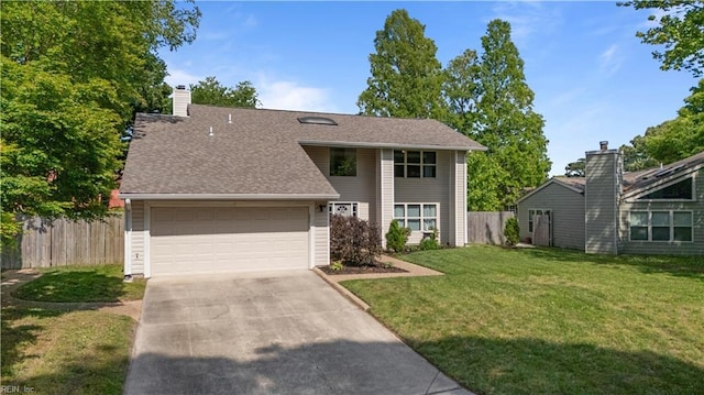 view of front of house with a garage, fence, a front yard, and concrete driveway