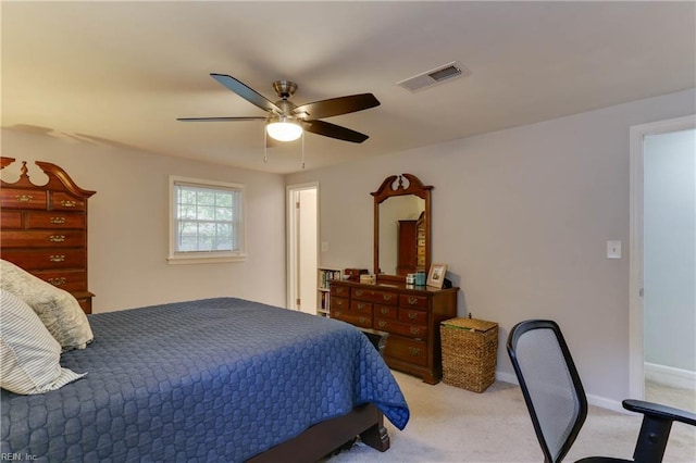 bedroom with a ceiling fan, light colored carpet, and visible vents