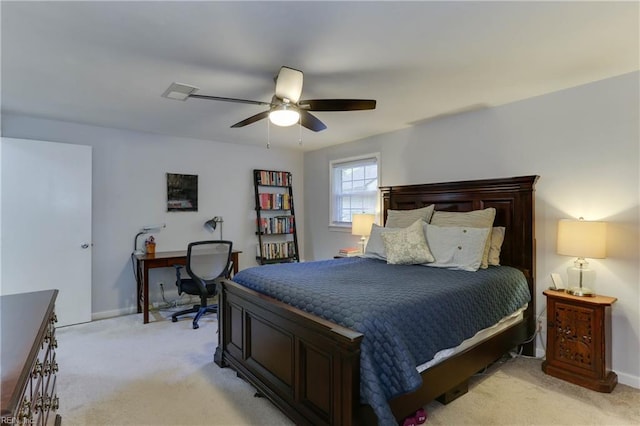 bedroom with light colored carpet, a ceiling fan, baseboards, and visible vents