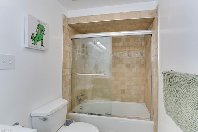 bathroom featuring toilet and enclosed tub / shower combo